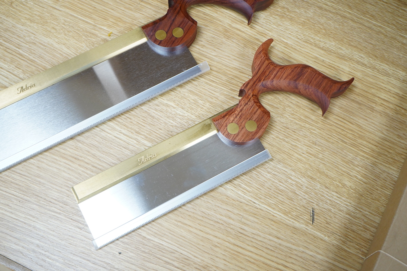 Two boxed Canadian Adria Toolworks Inc. wood saws; a small tenon rip saw, together with a dovetail saw